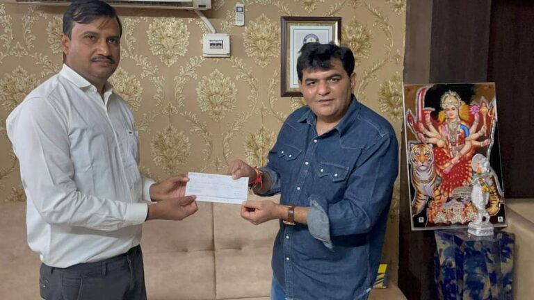 In Ambaji Mandir, Disa's servile youth leader Mr. P. N. Gardener Rs. 2,18,400/- presented a check